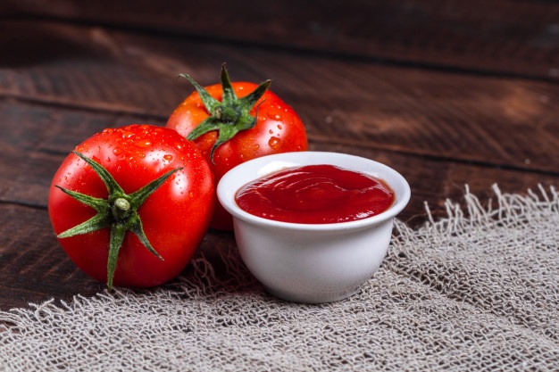 red-tomatoes-tomato-sauce-dark-wooden-background_122732-78
